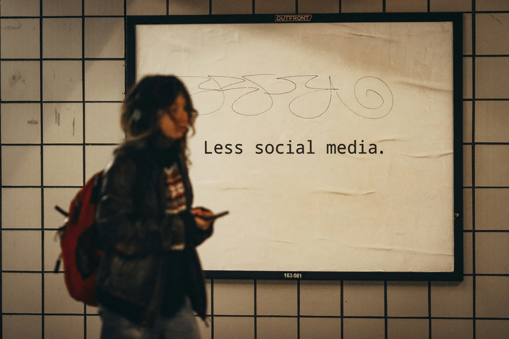 less social media sign with school girl